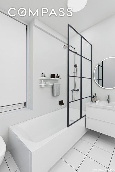 full bath with vanity, combined bath / shower with glass door, tile patterned floors, and toilet