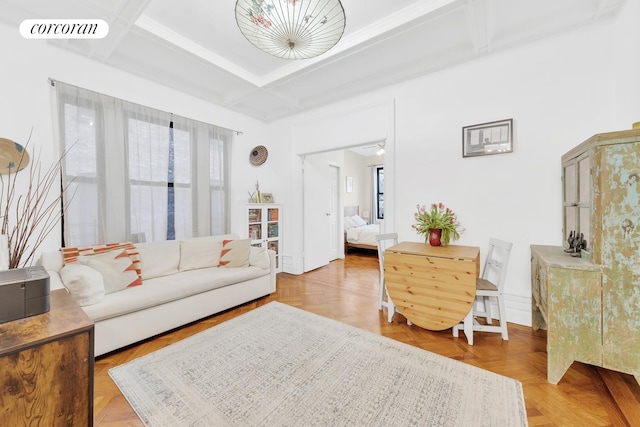 living room with coffered ceiling, visible vents, and plenty of natural light