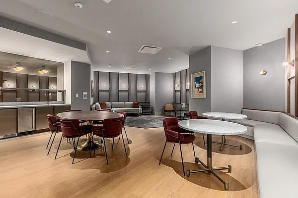 dining area featuring light wood finished floors and visible vents