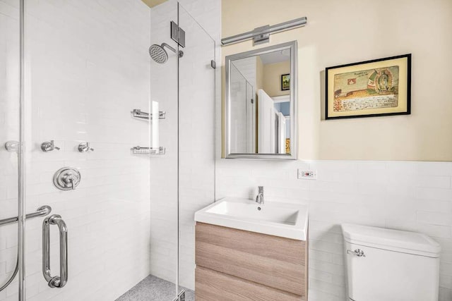 19 E 88th St Unit 15G, New York City, NY 10128 - bathroom with a stall shower, vanity, toilet, and tile walls