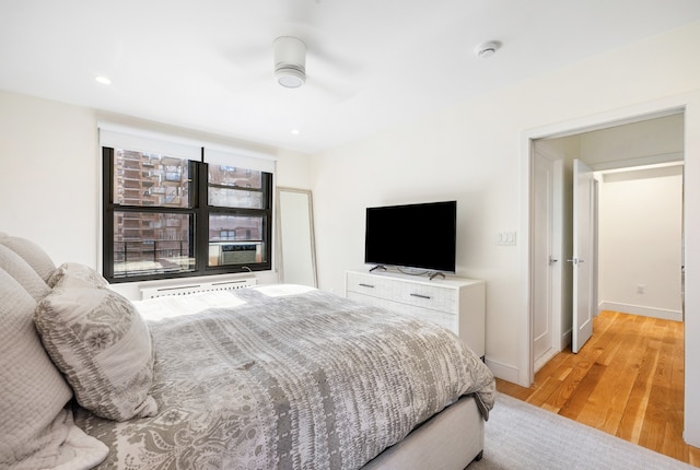 bedroom with ceiling fan, baseboards, wood finished floors, and recessed lighting