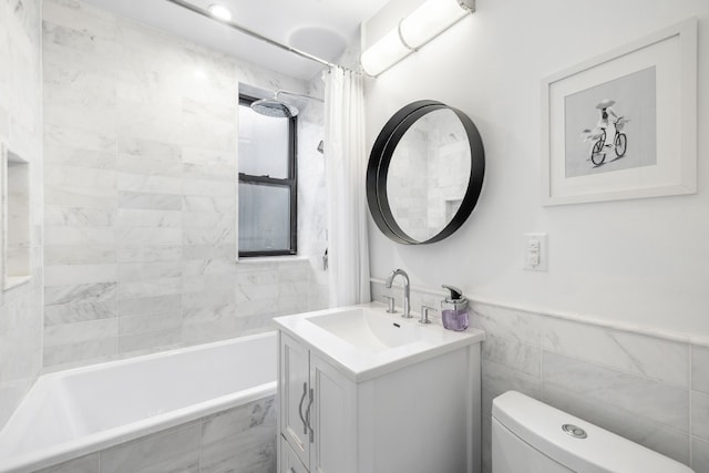 bathroom featuring tile walls, vanity, toilet, and shower / bathtub combination with curtain