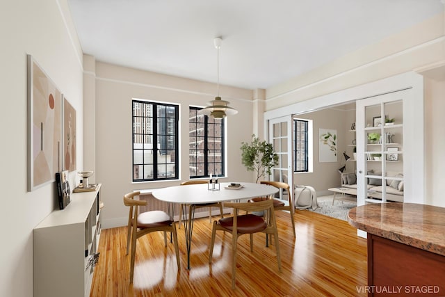 25 Tudor City Pl Unit 2119, New York City, NY 10017 - dining room featuring light wood-type flooring and baseboards