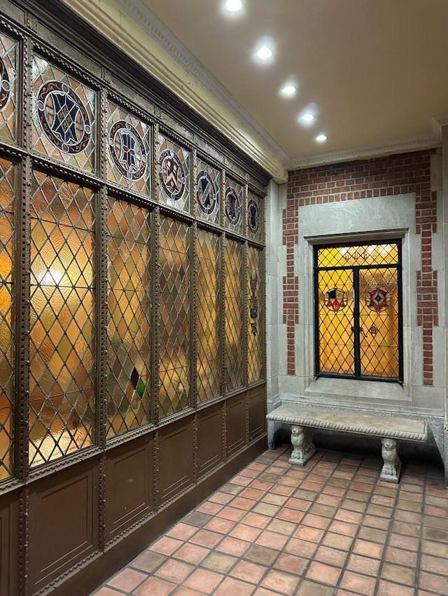 25 Tudor City Pl Unit 2119, New York City, NY 10017 - detailed view of crown molding, recessed lighting, and brick wall