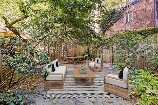 view of patio / terrace featuring fence and an outdoor hangout area