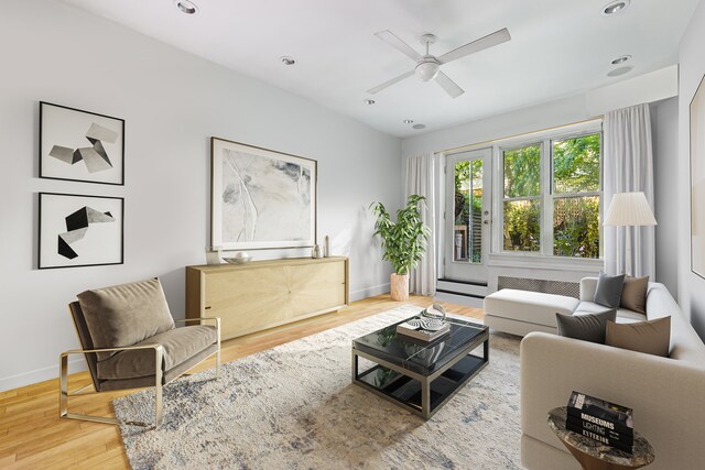 living room featuring recessed lighting, ceiling fan, baseboards, and wood finished floors