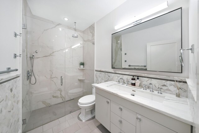10 Jay St Unit 4, New York City, NY 10013 - full bathroom with a marble finish shower, vanity, toilet, tile walls, and tile patterned floors