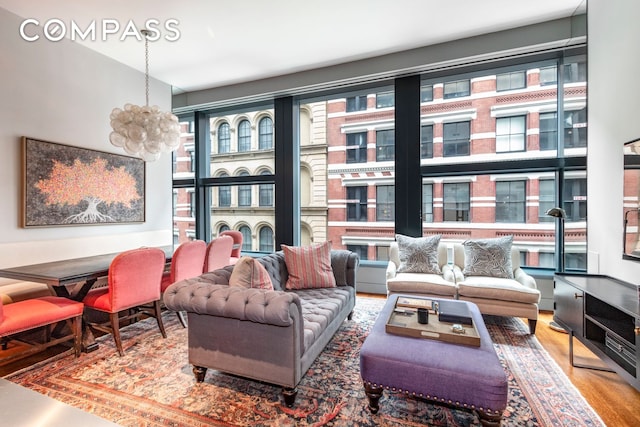 40 Mercer St Unit 9, New York City, NY 10013 - living area featuring wood finished floors and a chandelier