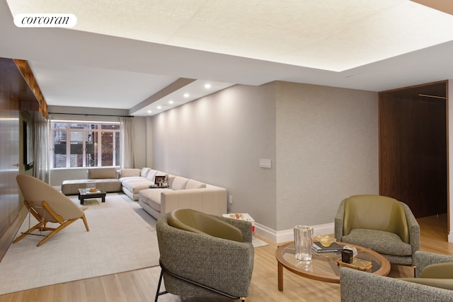 living room featuring recessed lighting, visible vents, baseboards, and wood finished floors