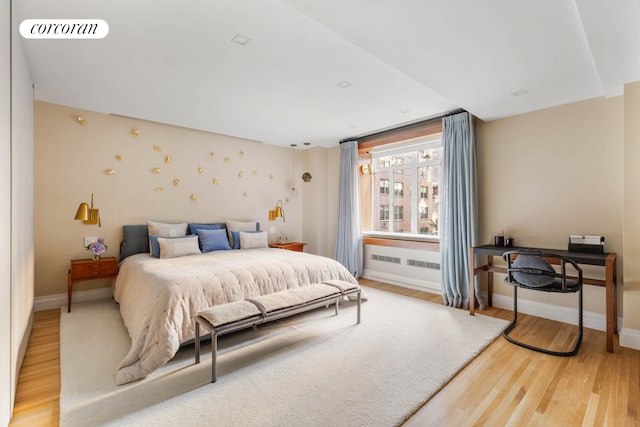 bedroom featuring light wood-type flooring, baseboards, and visible vents