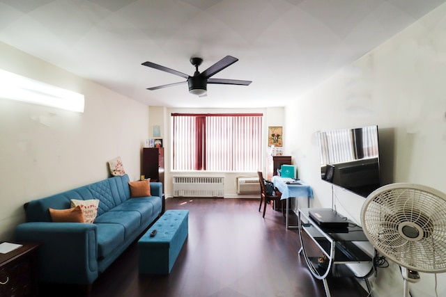 living area with ceiling fan, wood finished floors, and radiator