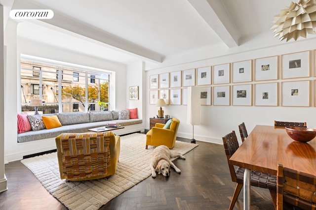 living room with visible vents, baseboards, and beamed ceiling