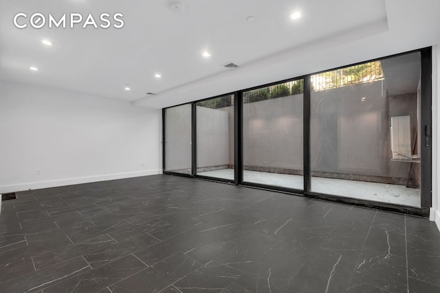 unfurnished room featuring visible vents, baseboards, and recessed lighting