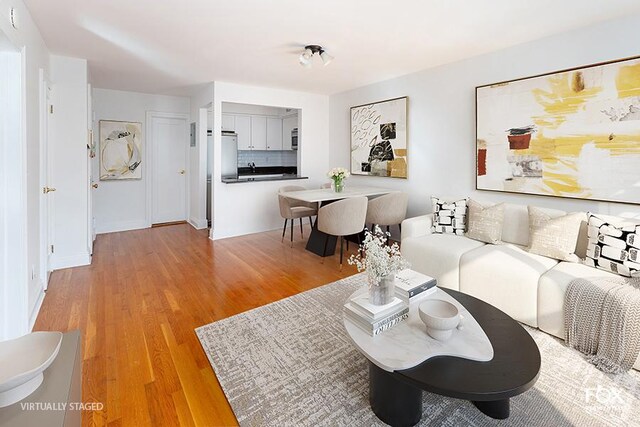 living area featuring light wood-style flooring