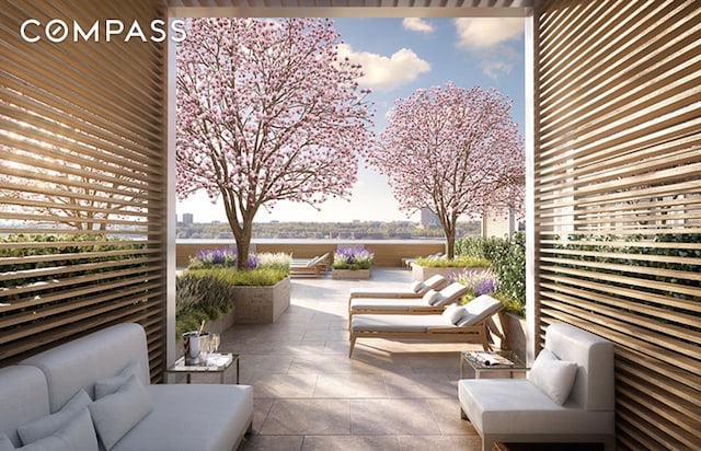 view of patio / terrace with a water view and an outdoor hangout area