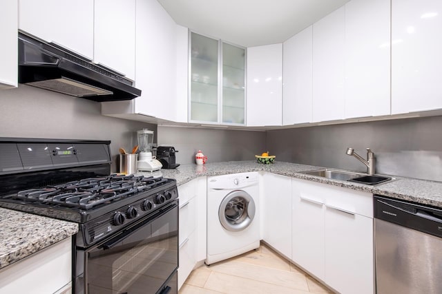 kitchen featuring washer / dryer, dishwasher, under cabinet range hood, a sink, and gas stove