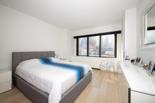 bedroom with light wood-style flooring