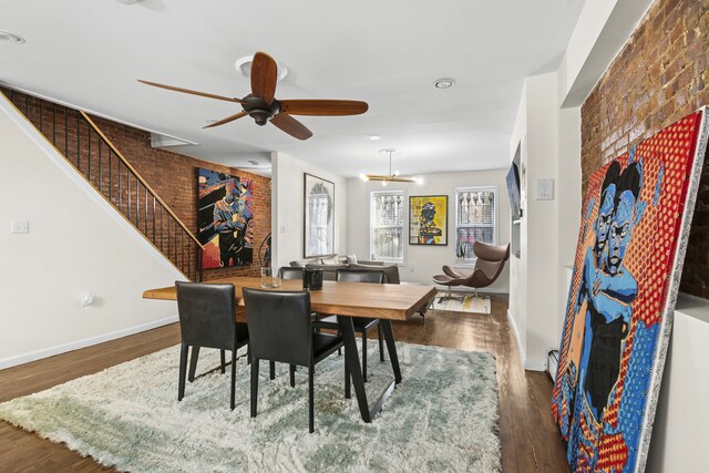 867 Lafayette Ave, New York City, NY 11221 - dining space with wood finished floors, ceiling fan, brick wall, stairway, and baseboards