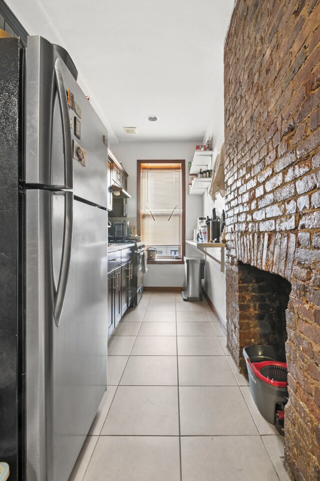 867 Lafayette Ave, New York City, NY 11221 - kitchen featuring stainless steel appliances and light tile patterned floors