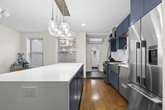 867 Lafayette Ave, New York City, NY 11221 - kitchen with stainless steel appliances, blue cabinets, dark wood-style floors, light countertops, and recessed lighting