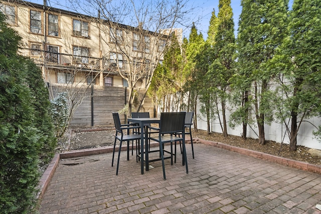 view of patio featuring a fenced backyard and outdoor dining space