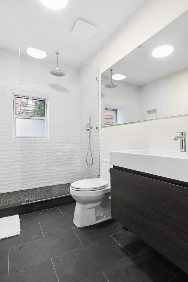 867 Lafayette Ave, New York City, NY 11221 - bathroom with vanity, toilet, walk in shower, and tile patterned floors