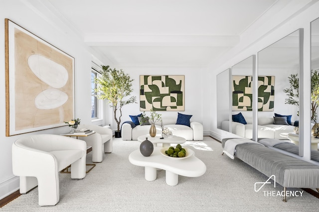 living room featuring beam ceiling and baseboards