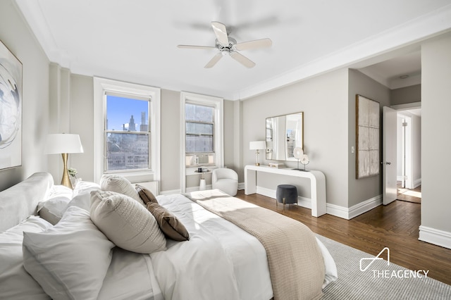 bedroom with wood finished floors, baseboards, and ceiling fan