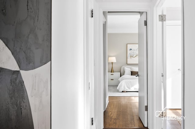 corridor featuring wood finished floors