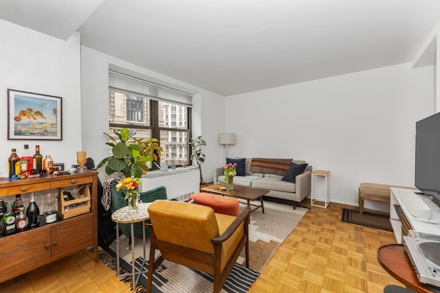 living area featuring baseboards