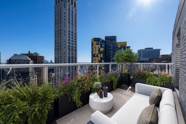 balcony with a view of city and outdoor lounge area