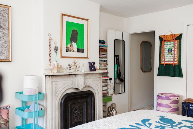 bedroom featuring a fireplace