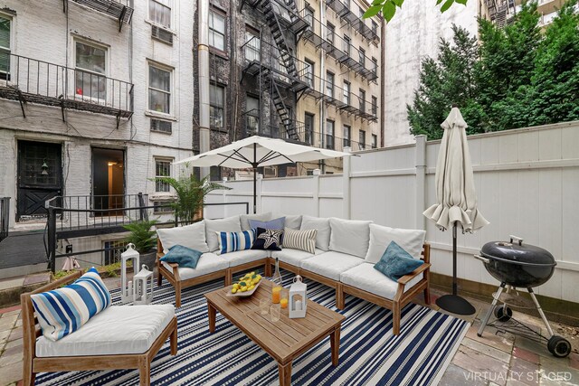482 E 74th St Unit 1C, New York City, NY 10021 - view of patio featuring outdoor lounge area and grilling area