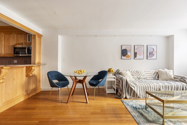 interior space with light wood-type flooring and baseboards