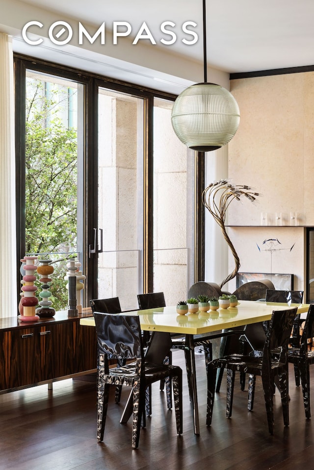 dining area with wood finished floors