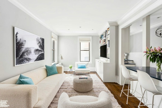 living room with baseboards, dark wood-type flooring, and crown molding