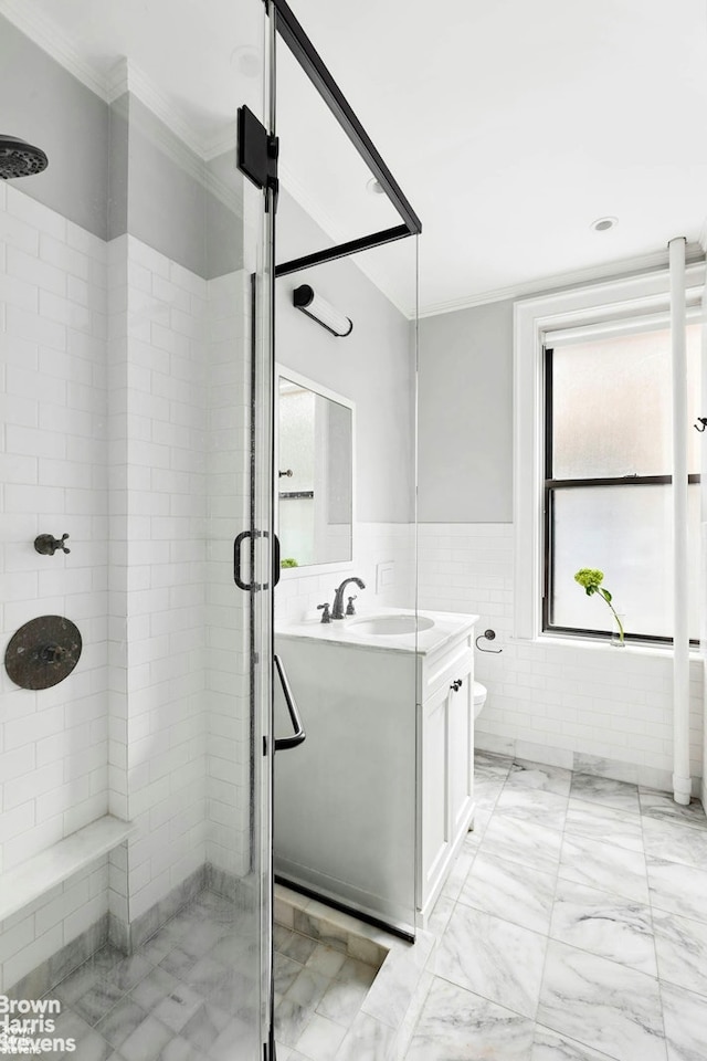 1361 Madison Ave Unit 6G, New York City, NY 10128 - full bath with a shower stall, vanity, crown molding, toilet, and tile walls
