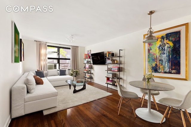 living area featuring wood finished floors and baseboards