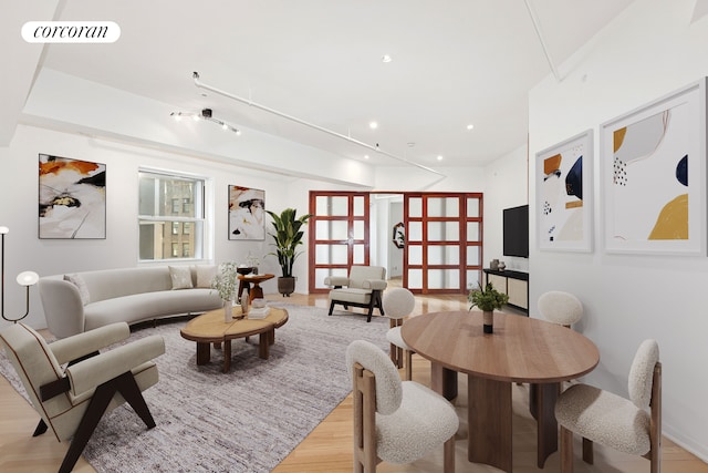 living area featuring light wood-style floors and recessed lighting