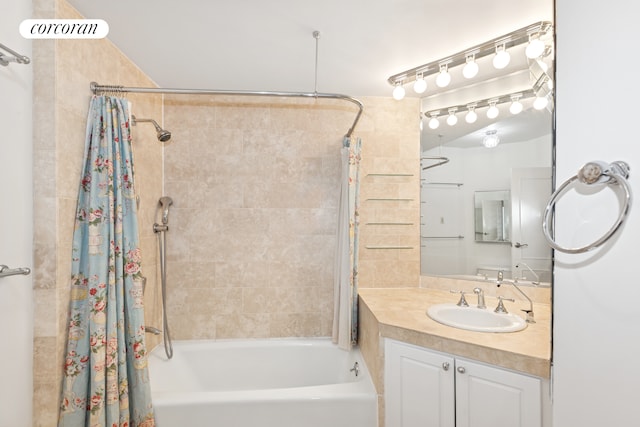 bathroom with shower / bath combo with shower curtain and vanity