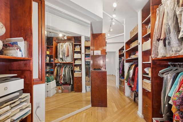 spacious closet with light wood finished floors