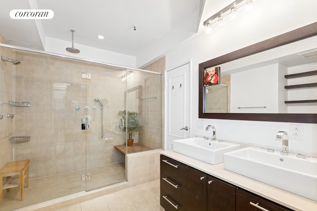 1200 Broadway Unit 7B, New York City, NY 10001 - bathroom with double vanity, a stall shower, tile patterned floors, and recessed lighting