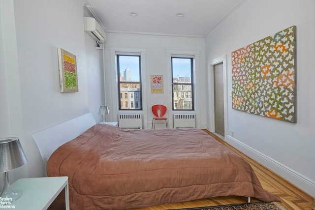 bedroom with radiator, baseboards, crown molding, and a wall mounted air conditioner