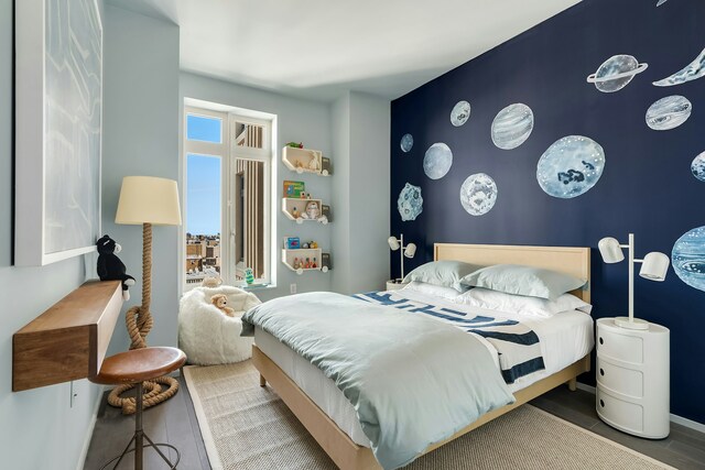 bedroom featuring an accent wall