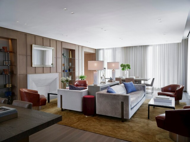 living room with wood finished floors and a fireplace