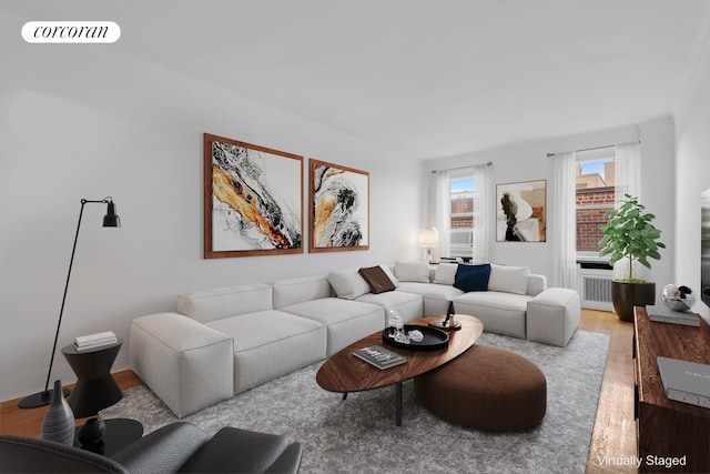 living area with light wood finished floors and visible vents