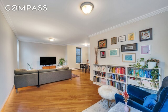 120 2nd Ave Unit 5A, New York City, NY 10003 - living room with ornamental molding, light wood-type flooring, and a baseboard radiator