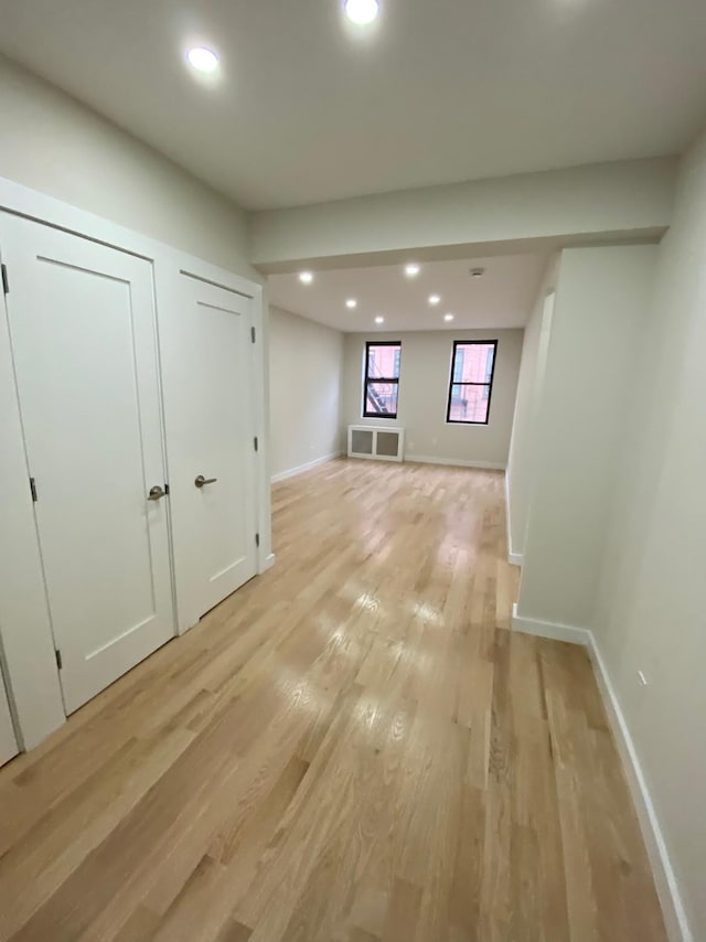 interior space featuring light wood-style floors, baseboards, visible vents, and recessed lighting