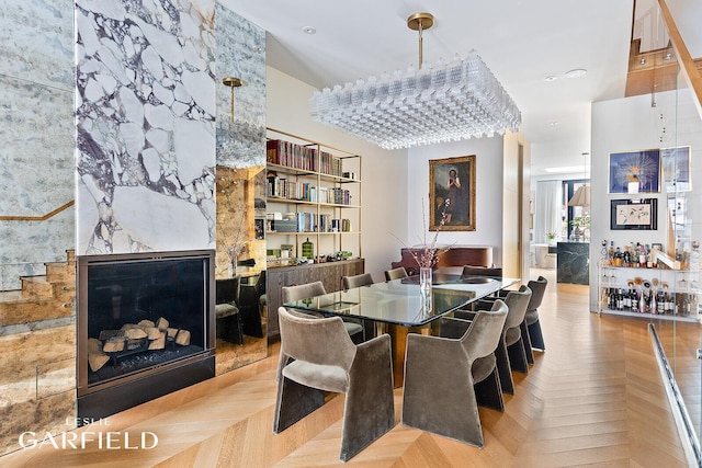 dining room featuring a large fireplace