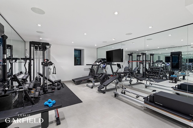 exercise room featuring recessed lighting and baseboards